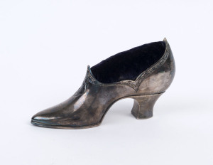 An antique silver plated pin cushion, 19th century, 9.5cm high, 17cm long
