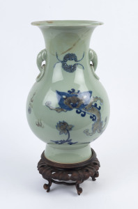 A Chinese celadon porcelain dragon vase (badly damaged), on wooden stand, Republic period, 47cm high overall