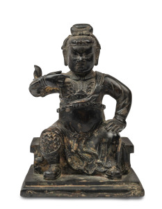 A Chinese cast bronze statue of a seated warrior, Qing Dynasty, 19th century, 12cm high