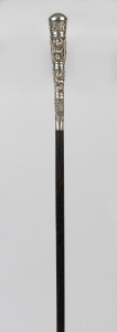 A walking stick with Thai silver handle, ebonized shaft and brass ferrule, 19th century, 92cm high