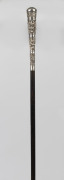 A walking stick with Thai silver handle, ebonized shaft and brass ferrule, 19th century, ​92cm high