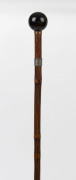 A walking stick with spherical tiger eye handle, silver and gold plated collars, cane shaft and metal ferrule, 19th century, ​83cm high