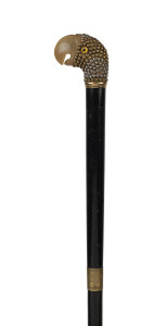 An antique walking stick with parrot head handle, ebony shaft and later rubber ferrule, 19th century, 87cm high