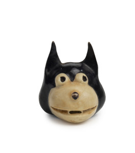 "FELIX THE CAT": rare celluloid pull-out tape measure in the form of Felix's head, the pull-out tongue missing; c.mid-1920s, height 4.5cm, width 4cm.