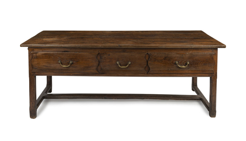 An antique Spanish sideboard, three drawers with stretcher base, slab chestnut with brass swinging handles, 18th century, 73cm high, 198cm wide, 72cm deep