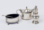 Sterling silver mustard pot, salt cellar and pepper pot with two silver spoons, the pepper pot 8cm high, 88 grams silver weight total