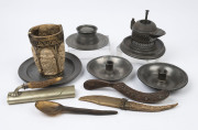 Pewter candle holders, plates, shop counter bell, inkwell, horn spoon, knife, crumb tray and brush, plus a medieval style vessel, 19th and 20th century, (11 items), the plates 23cm diameter