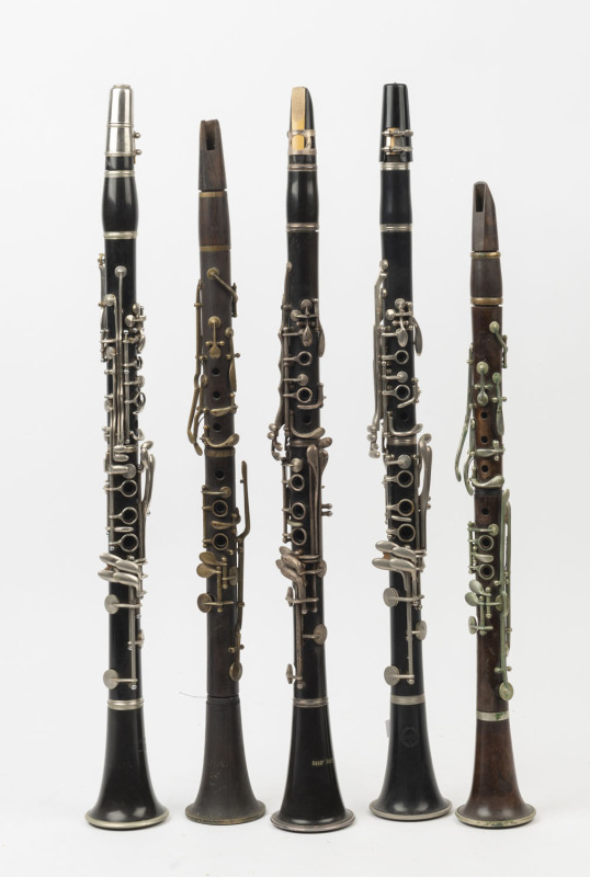 Five assorted vintage and antique clarinets, wood and bakelite, the largest 68cm long