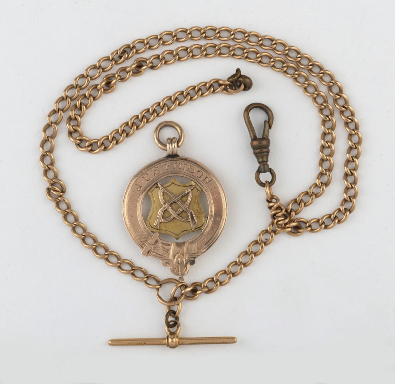 An antique 15ct gold watch chain together with a gold trophy fob, ​25 grams total