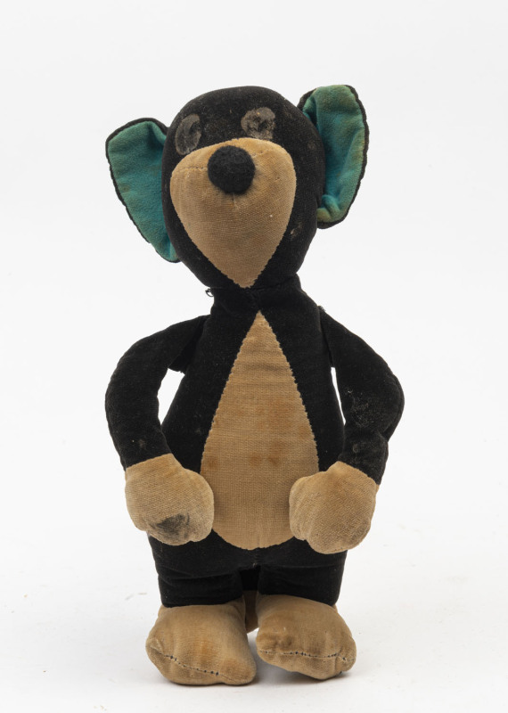 MERRYWEATHER TEDDY BEAR: fully jointed black & white bear, green inner ears; well loved, c.1945-1950, height 30cm.