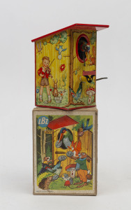 LBZ (GERMANY):- Boxed: "Pecking Bird" tinplate money box with hand-cranking mechanism enabling a Woodpecker to grab coins placed in a slot on the outside of a birdbox; with original box, c.1950s, height 13cm.