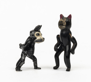 "FELIX THE CAT": painted lead figurine showing Felix walking with hands behind his back, height 7cm; also rare early celluloid figure of Felix, made in Japan, height 9cm; both items c.1920s.