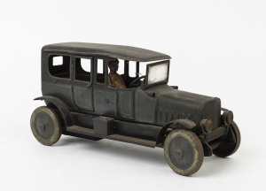 LARGE WIND-UP LIMOUSINE: lithographed tinplate car by Distler (Germany), with green body, black roof, intact running boards, and uniformed driver, two opening doors; c.1920s, length 30cm, height 15cm.