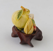 A Chinese carved ivory pomegranate
