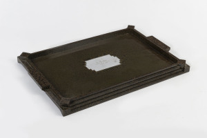 An Art Deco serving tray, green mottled bakelite with sterling silver plaque, mid 1930s, made by E.W. Lilley of Melbourne, 48cm across the handles