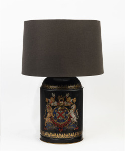 A Florentine Italian black metal table lamp and shade decorated with an ornate crest, late 20th century, ​61cm high overall