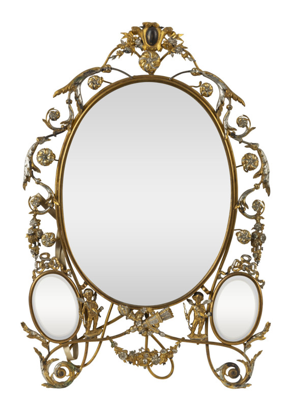 A French table mirror decorated with cupids and floral swags, silvered and gilt metal, circa 1860s, ​43cm high