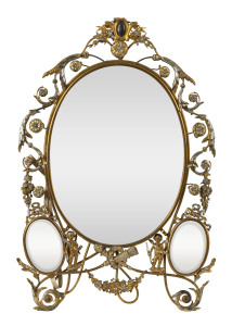 A French table mirror decorated with cupids and floral swags, silvered and gilt metal, circa 1860s, ​43cm high