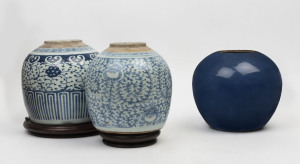 Three Chinese ceramic jars and two wooden stands, 20th century, (5 items), the largest 22cm high