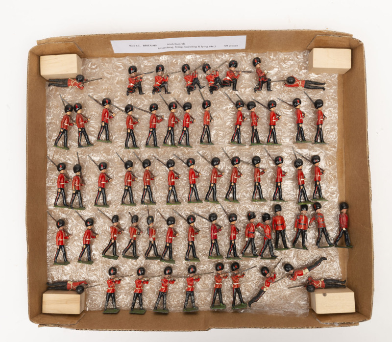 BRITAINS: - 54mm Hollow Cast Lead - Irish Guards: comprising Marching Figures With Rifle (34), Marching Figures With Sword (6), Standing Firing Rifles (7), Kneeling Firing Rifles (5), Prone Firing Rifles (6), plus a single figure Kneeling with Binoculars