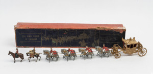 BRITAINS: - Boxed - State Coach of England: eight-horse-drawn carriage with the horses arranged in postillion mounted pairs, plus two ceremonial outriders and a throne; c.1950s, total length 49cm, box length 55cm.