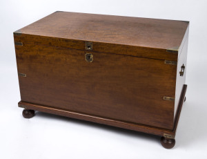 An antique lift top trunk, mahogany with brass bound corners and bun feet, 19th century, ​57cm high, 91cm wide, 50cm deep