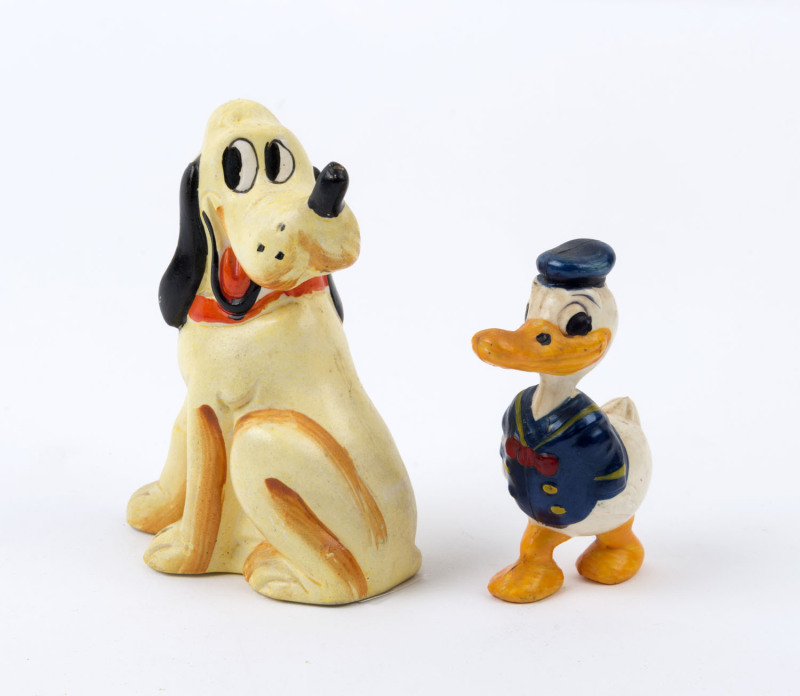DONALD DUCK & PLUTO: celluloid Donald Duck figurine with long beak and small non-webbed feet, height 8cm; also bisque Pluto salt shaker, height 10cm; both made in Japan; c.1930s. (2)