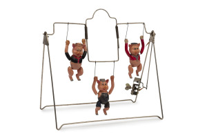 "THE THREE PIGS": rare wind-up toys with three celluloid pigs mounted upon a metal trapeze, each pig with impressed 'Walt Disney' on reverse; made in Japan, c.1930s, width 28cm, height 28cm.