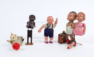 Celluloid wind-up toys comprising "Baby having Tantrum" with mechanism controlling arm and leg movement, "Cat and Ball" with movement enabling cat to chase the ball, "Couple arm-in-arm carrying suitcase" (faulty) with wind-up mechanism (in suitcase) contr