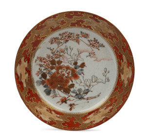 A Japanese Kutani ware porcelain plate with floral decoration in clouds, Meiji period, 19th century, eight character mark to base, 20cm diameter