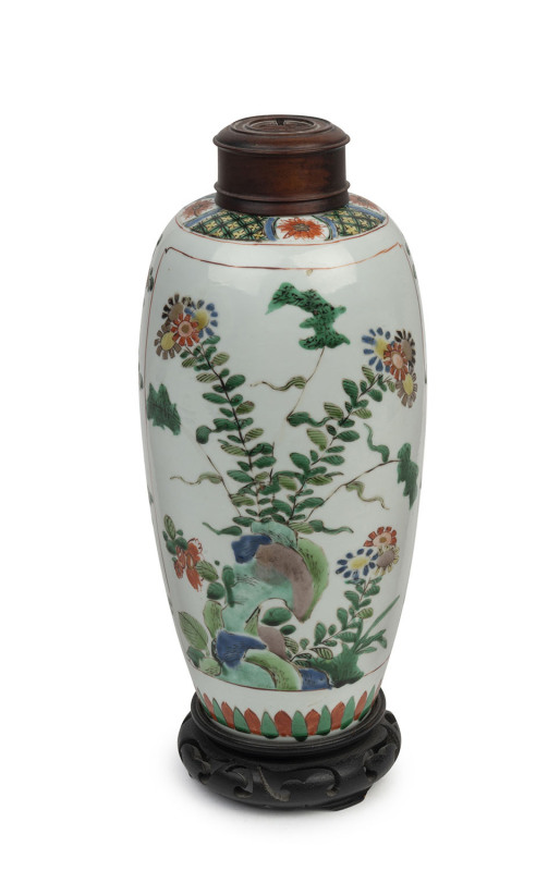 A fine Chinese famille verte porcelain vase of slender ovoid form painted with panels of prunus, peonies and chrysanthemum among rockwork, Kang-Xi period, circa 1700, 25cm high. PROVENANCE: The John Kenny Collection