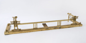 An antique brass fire curb, late 19th century, 20cm high, 132cm wide, 35cm deep