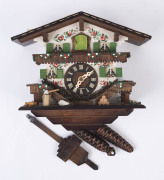 A vintage German cuckoo wall clock in the form of a chalet, 20th century, 34cm high including pendulum, 24cm wide
