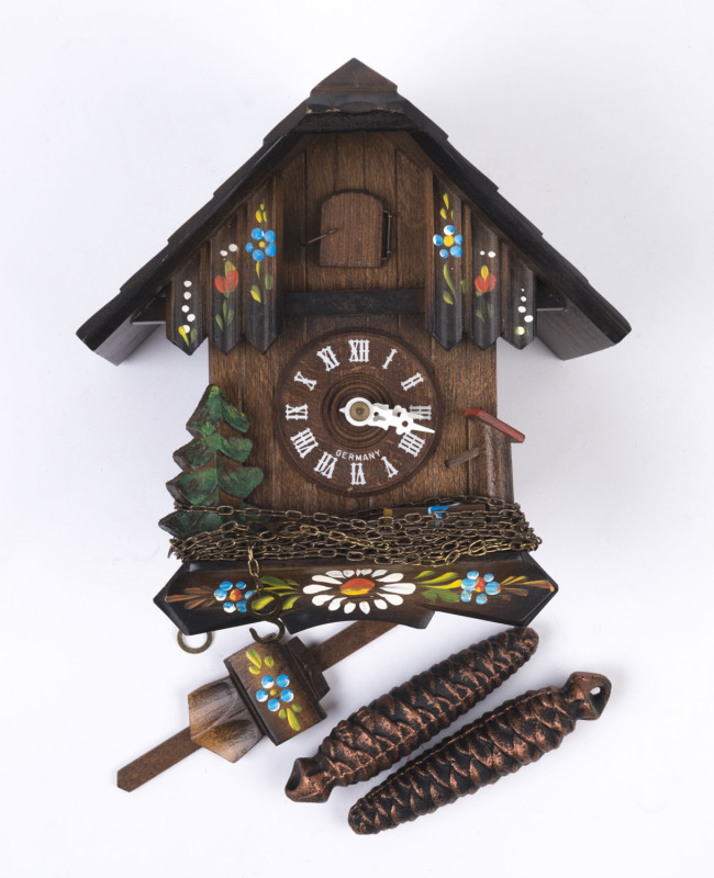 A vintage German cuckoo wall clock, 20th century, 33cm high including pendulum, 19cm wide