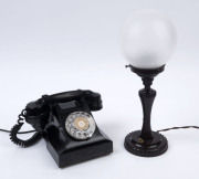 A vintage black bakelite telephone together with a brown bakelite and glass table lamp, circa 1930, ​the lamp 37cm high