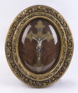 An oval framed Christ on crucifix behind convex glass, early 20th century, 50 x 42cm