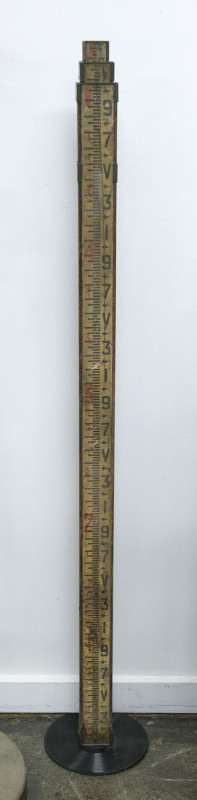 An antique telescopic survey rule, extends from 5ft to 14ft