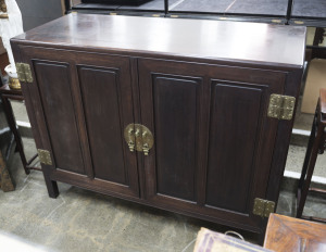 A Chinese two door cabinet, rosewood, Guangxu Period, late 19th century, 106cm high, 137cm wide, 55cm deep