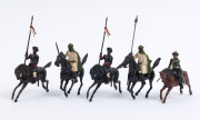 BRITAINS: - 54mm Hollow Cast Lead - Bedouin/Arabic Figures: with Mounted on Horseback Charging Figures (16), armed with rifles, lances or swords, one with bugle; Unmounted Figures (17), five charging with fixed bayonets, three charging with lances, seven - 8