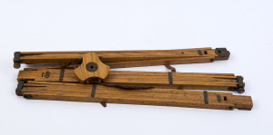 An antique folding timber camera tripod, 19th century, folds to 45cm high