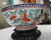 A Chinese porcelain bowl with Amsterdam Bont Dutch decoration of exotic birds and foliage, circa 1720, with accompanying carved wooden stand, 6.5cm high, 14.5cm diameter - 6