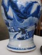 A fine Chinese baluster shaped vase with underglaze blue decoration of fishing figures in landscape, Kangxi Period, circa 1700, with carved hardwood lid and timber stand, 26cm high - 13