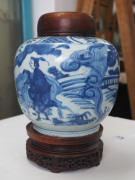 A Chinese ovoid porcelain jar, underglaze blue decoration with figures and donkey in landscape, Ming Dynasty, circa 1500, with accompanying finely carved wooden stand and lid, ​23cm high overall - 2