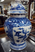 An impressive pair of Chinese porcelain vases and covers finely decorated in underglaze blue depicting precious objects and foliage, late Qing Dynasty, 19th century, ​49cm high - 11