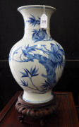 A Chinese baluster shaped blue and white porcelain vase with wooden stand, Republic period, ​34cm high - 4