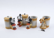 MICKEY & MINNIE MOUSE & PLUTO; ceramic Jam Jars, with figurines attached to fronts, comprising Mickey, Minnie (2, one without lid) & Pluto (broken ear, no lid), one with 'Regn No. 14755' stamped on base, made in Japan c.1930s, each 10cm high. (4)