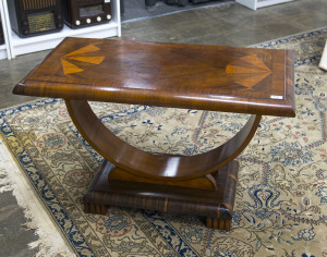 An Art Deco occasional table, walnut and maple veneer, circa 1930, 62cm high, 98cm wide, 52cm deep