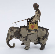 Tinplate toy selection comprising Louis Marx (USA) wind-up "Golden Goose"; Stollwerck Bros candy "Liliputian Savings Bank" candy store; unusual "buckets on a pulley" wheel-driven toy, plus wind-up "Mahout riding Elephant" with rearing motion when activate - 5