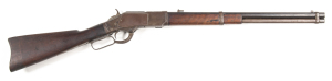 WINCHESTER MOD.1873 S/R CARBINE: converted to 22 Cal short; 15 shot tube mag; 19½" round barrel with no visible address or Cal markings; g. bore; fitted with the 66 type single leaf flip up sight; MODEL 1873 to tang; wear to profiles; blue/plum finish to 