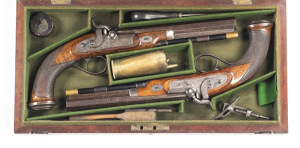 CASED PAIR OF PERCUSSION S/B COACHING PISTOLS by ROFS OF EDINBURGH: 50 Cal; 8½" damascus octagonal barrels; silver bead front sights, notched rear sights at the breeches with a single silver band; top barrel flats inscribed ROFS EDINBURGH; foliate engrave